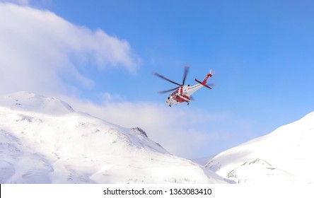 LAPLAND - SWEDEN, March 22, 2019: Search And Rescue Helicopter Flying Over National Park Sarek On A Mission To Find A Missing Person.