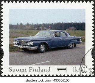 LAPPEENRANTA, FINLAND - AUGUST 12, 2013: A Stamp Printed In Finland Shows Plymouth Fury, Series Finland Official Vintage Police Car