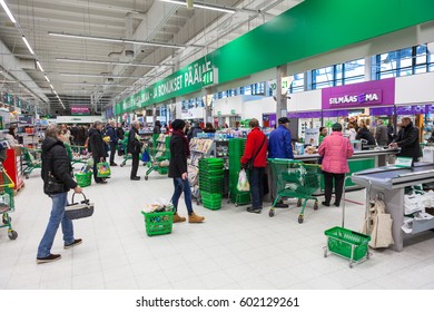 LAPPEENRANTA, FINLAND - CIRCA FEB, 2016: Customers stand in queue to checkout lane of Prisma hypermarket. Prisma is the family-friendly hypermarket of the cooperative S Group