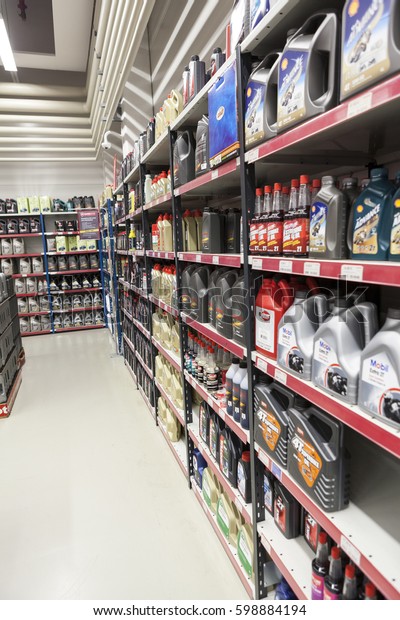 LAPPEENRANTA, FINLAND - CIRCA FEB, 2016: Plastic\
cans with auto and motorbike oils and lubricants are in auto parts\
store. The Motonet is a large chain retailer of auto and motorcycle\
goods in Finland