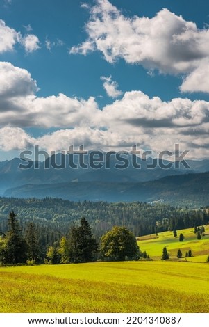 Similar – Image, Stock Photo Inspiring evening light in spring. Sunset in Mountains