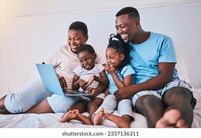 Laptop, black family and relax in a bed with movies, games and streaming in their home. Online, film and children with parents in bedroom for weekend fun, subscription or cartoon, care and smile - Powered by Shutterstock