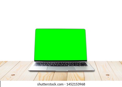 Laptop With Blank Green Screen On Table Isolated White Background.