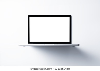 Laptop with blank screen mockup concept. Creative workspace background. - Powered by Shutterstock