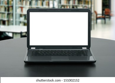 laptop with blank screen on the table in library