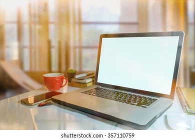 Laptop With Blank Screen On Table In Living Room.