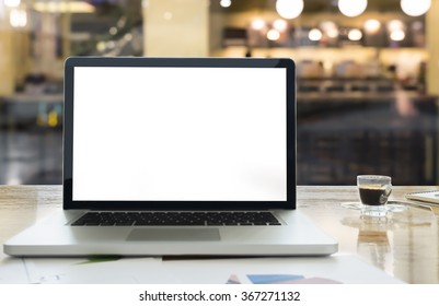 Laptop With Blank Screen On Table With Blur Background Of Share Workspace Coffee Cafe.
