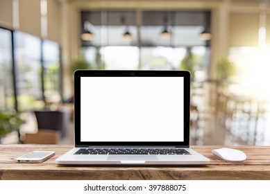 Laptop With Blank Screen On Table Of A Cafe