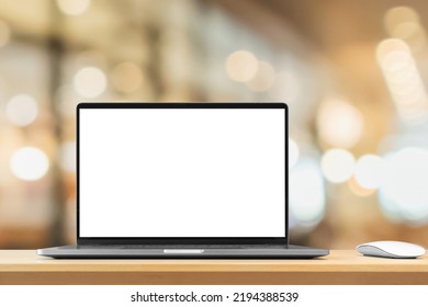 Laptop With Blank Screen On Wood Table With Cafe Coffee Shop Blur Background