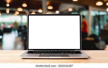 Laptop blank screen on wood table with coffee cafe background, mockup, template for your text, Clipping paths included for background and device screen - Powered by Shutterstock