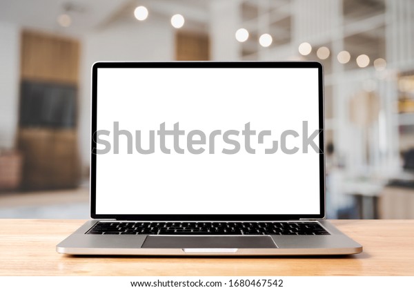 Laptop blank screen on wood table with\
coffee cafe background, mockup, template for your text, Clipping\
paths included for background and device\
screen