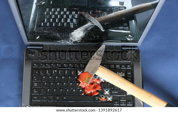 laptop broken with a\
hammer