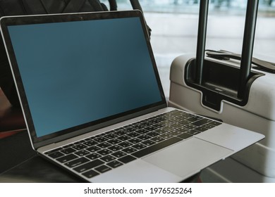 Laptop By A Luggage In The Airport