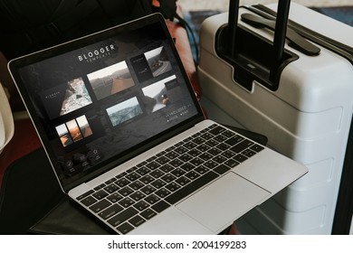 Laptop By A Luggage In The Airport