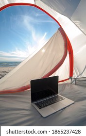 Laptop In Camping Tent On Beach