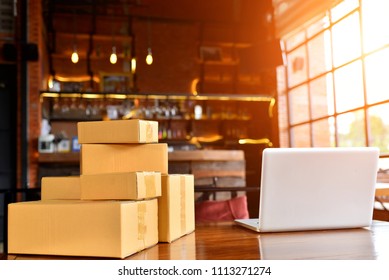 Laptop, Carton Box, Parcel Of Goods To Deliver To Customers. Online Sales Of Ecommerce Packaging Ideas