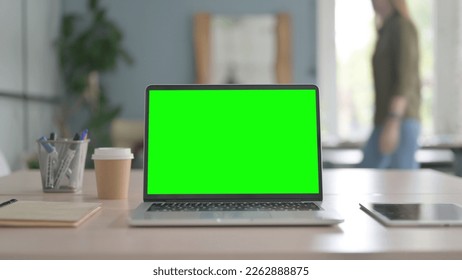 Laptop with Chroma Key Screen on Desk, Green Screen - Powered by Shutterstock