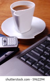 Laptop, coffee and cell