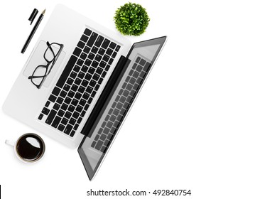 Laptop, Coffee Cup And Office Supplies Are Isolated On White Background. Top View With Copy Space, Flat Lay.