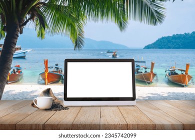 A laptop and a coffee cup on a wood table at a coconut tree-lined seaside, representing the concepts of travel and the digital nomad. - Powered by Shutterstock