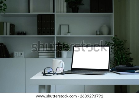 Laptop computer blank screen with clipping path on table. Workspace concept.