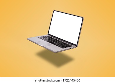 Laptop computer with blank screen isolated on yellow background