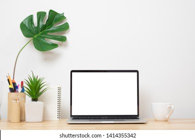 Laptop Computer Blank Screen On Wood Desk. Minimal Style Desk. Front View Workspace And Copy Space