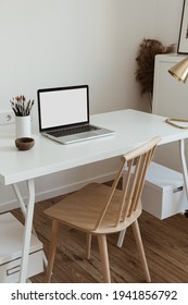 Laptop computer with blank screen on table. Aesthetic minimal office workspace interior design template with mockup copy space. - Shutterstock ID 1941856792