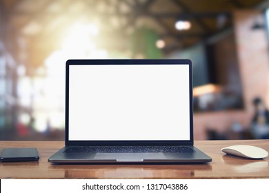 laptop computer blank white screen and mobile on table in cafe background - Shutterstock ID 1317043886
