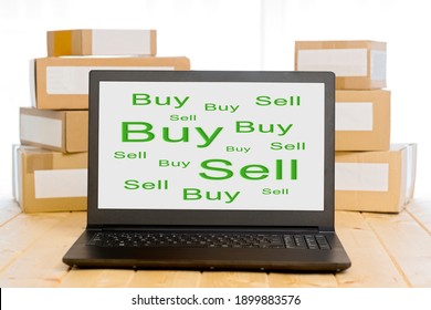 Laptop Computer With Cardboard Boxes With White Labels , Concept Buy And Sell Online