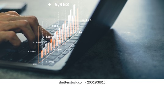 Laptop or computer with chart. Investment in business and financial concept of growth and success. Investor data analysis for planning in strategy of stock market fund. Invest for earning or profit. - Shutterstock ID 2006208815