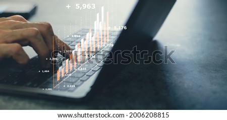 Laptop or computer with chart. Investment in business and financial concept of growth and success. Investor data analysis for planning in strategy of stock market fund. Invest for earning or profit.