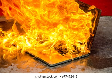 laptop-computer-exploding-into-flames-260nw-677472445.jpg