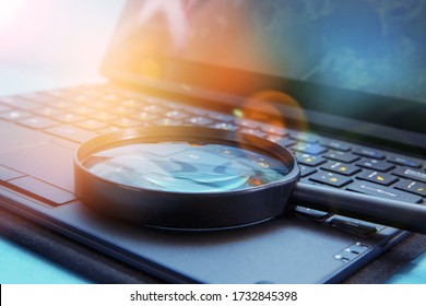 Laptop Computer With Magnifying Glass, Concept Of Search