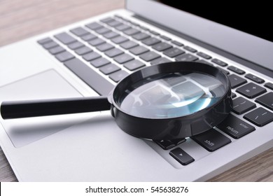 Laptop Computer With Magnifying Glass, Concept Of Search