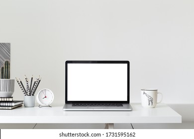 Laptop, computer at minimal workplace. Stylish home office workspace. - Powered by Shutterstock