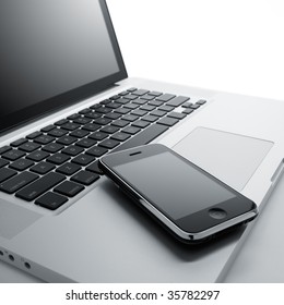 Laptop Computer And Mobile Phone Against White Background