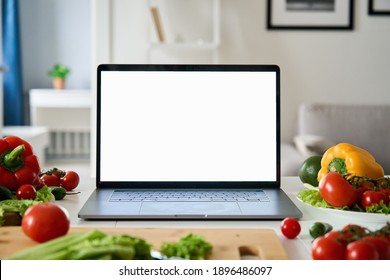 Laptop Computer With Mockup White Screen On Vegetarian Healthy Food Vegetable Background. Online Grocery Shopping Delivery App Ads Concept, Cook Book Diet Plan Nutrition Recipes, Close Up View.