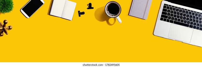 Laptop computer with office supplies - flat lay - Shutterstock ID 1782495605