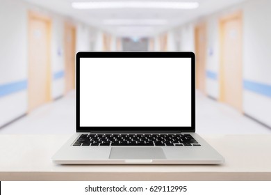 Laptop Computer On Medical Table With Hospital Background