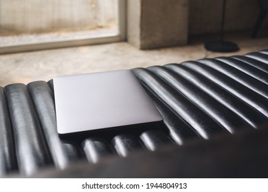 A laptop computer on the sofa