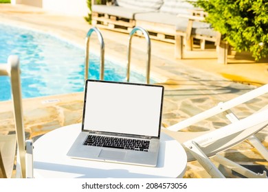 laptop computer on table pool background