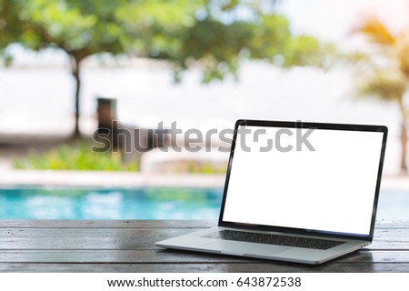 laptop computer on table white screen bach background