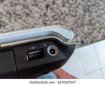 Laptop Computer Power Jack And USB Port Above A Granite Table