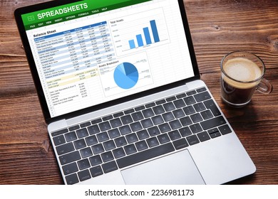 Laptop computer with sample spreadsheets document on the screen - Shutterstock ID 2236981173