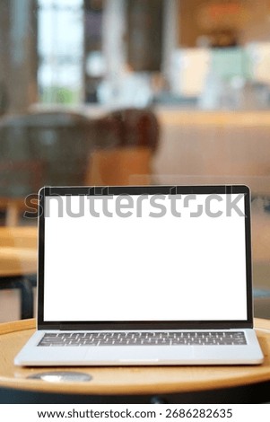 Laptop computer screen mockup, template background, Laptop computer with blank screen over blur cafe background, Business online, e commerce, online study concept 