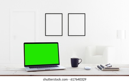 Laptop Computer Showing Green Screen In Home Interior Background