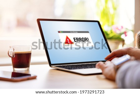Laptop computer showing unknown error warning