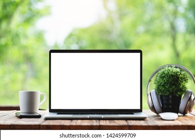 laptop computer showing white frame morning nature background - Powered by Shutterstock