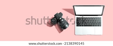 Laptop computer with a SLR camera from above